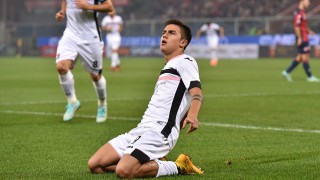 GENOA, ITALY - NOVEMBER 24: Paulo Dybala (R) of US Citta di Palermo celebrates after scoring the opening goal during the Serie A match between Genoa CFC and US Citta di Palermo at Stadio Luigi Ferraris on November 24, 2014 in Genoa, Italy. (Photo by Valerio Pennicino/Getty Images)