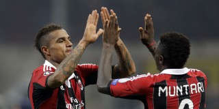 AC Milan midfielder Kevin Prince Boateng, of Ghana, celebrates with his teammate Sulley Muntari, of Ghana, right, at the end of the Champions League round of 16, first leg soccer match against Barcelona, at the San Siro stadium in Milan, Italy, Wednesday, Feb. 20, 2013. AC Milan won 2-0. (AP Photo/Luca Bruno)