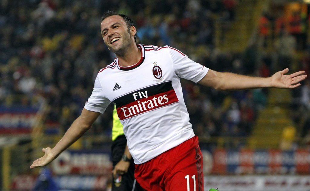 AC Milan's Pazzini celebrates after scoring a third goal against Bologna during their Italian Serie A soccer match at the Dall'Ara stadium in Bologna