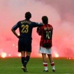 Inter Milan's Materazzi and Rui Costa of AC Milan wait on the pitch during their Champions League soccer match in Milan