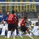 AC Milan's Andrea Pirlo shoots a free kick and scores against Inter Milan in Milan