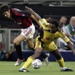 Kaka of AC Milan is tackled by Emerson
