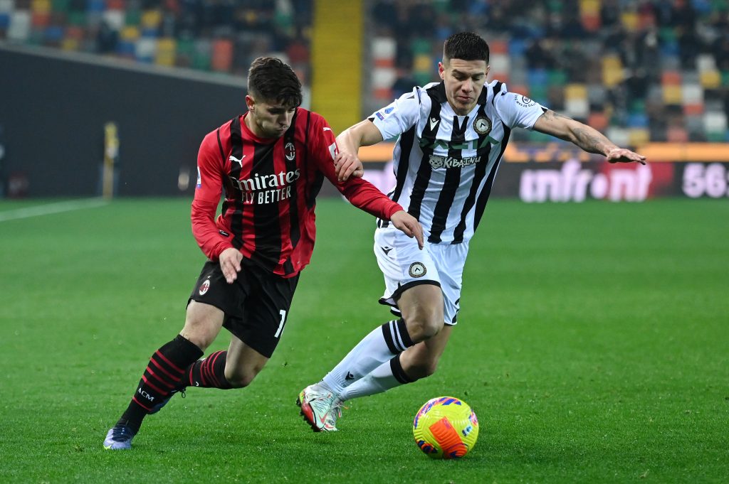 UDINE, ITALY - DECEMBER 11: Brahim Diaz of AC Milan battles for possession with Nehuen Perez of Udinese Calcio during the Serie A match between Udinese Calcio and AC Milan at Dacia Arena on December 11, 2021 in Udine, Italy. (Photo by Alessandro Sabattini/Getty Images)