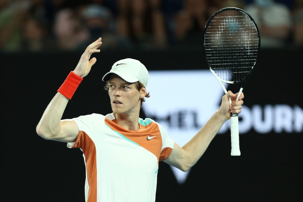 MELBOURNE, AUSTRALIA - JANUARY 26: Jannik Sinner of Italy celebrates a point and tries to get the crowd goin in his Men's Singles Quarterfinals match against Stefanos Tsitsipas of Greece during day 10 of the 2022 Australian Open at Melbourne Park on January 26, 2022 in Melbourne, Australia. (Photo by Mark Metcalfe/Getty Images)