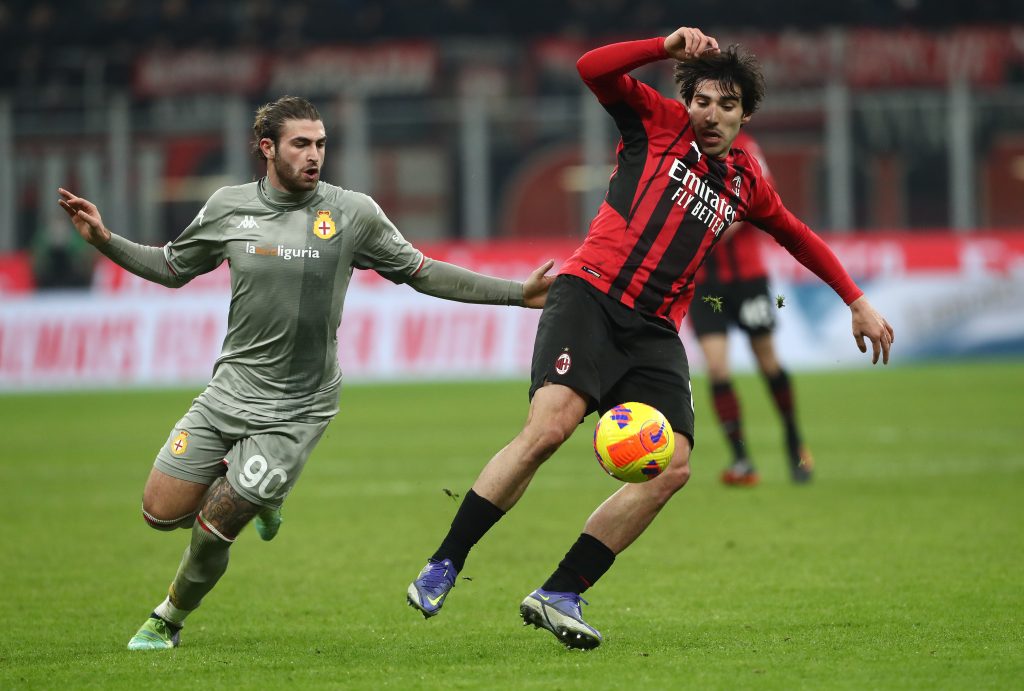 MILAN, ITALY - JANUARY 13: Manolo Portanova of Genoa CFC and Sandro Tonali of AC Milan battle for the ball during the Coppa Italia match between AC Milan and Genoa CFC at Stadio Giuseppe Meazza on January 13, 2022 in Milan, Italy. (Photo by Marco Luzzani/Getty Images)