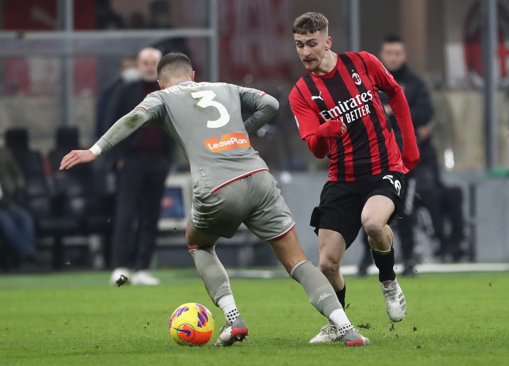 MILAN, ITALY - JANUARY 13: Zinho Vanheusden of Genoa CFC and Alexis Saelemaekers of AC Milan battle for the ball during the Coppa Italia match between AC Milan and Genoa CFC at Stadio Giuseppe Meazza on January 13, 2022 in Milan, Italy. (Photo by Marco Luzzani/Getty Images)