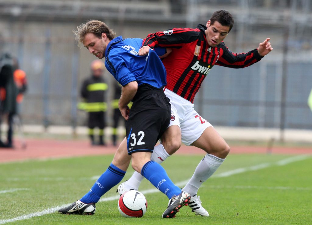EMPOLI, ITALY - MARCH 09: Yoann Gourcuff of AC Milan tackles Alessandro Budel of Empoli during the Serie A match between Empoli and AC Milan at the Stadio Carlo Castellani on March 9, 2008 in Empoli, Italy. (Photo by New Press/Getty Images)