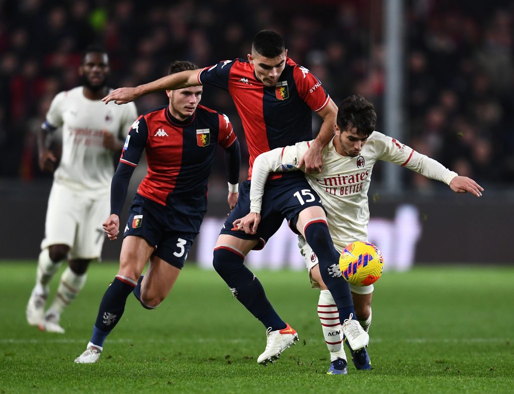 GENOA, ITALY - DECEMBER 01: Brahim Diaz of AC Milan competes for the ball with Johan Vasquez of Genoa CFC during the Serie A match between Genoa CFC and AC Milan at Stadio Luigi Ferraris on December 01, 2021 in Genoa, Italy. (Photo by Claudio Villa/AC Milan via Getty Images)
