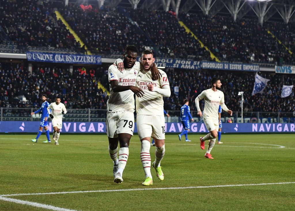EMPOLI, ITALY - DECEMBER 22: Franck Kessie of AC Milan celebrates with teammate Theo Hernandez after scoring the opening goal during the Serie A match between Empoli FC and AC Milan at Stadio Carlo Castellani on December 22, 2021 in Empoli, Italy. (Photo by Claudio Villa/AC Milan via Getty Images)