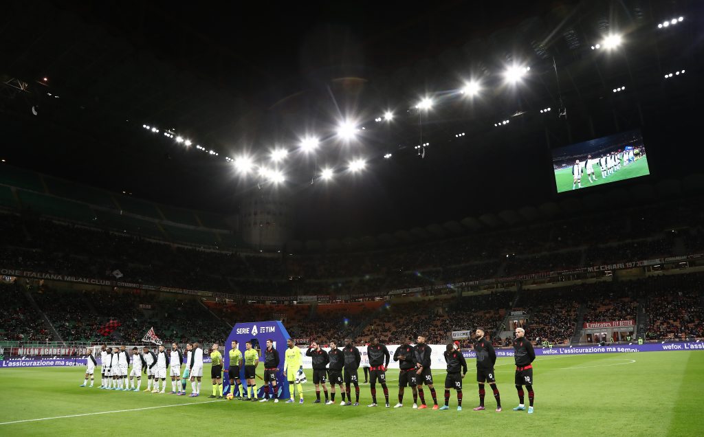 MILAN, ITALY - FEBRUARY 25: APlayers line up prior to the start of the Serie A match between AC Milan and Udinese Calcio at Stadio Giuseppe Meazza on February 25, 2022 in Milan, Italy. (Photo by Marco Luzzani/Getty Images)