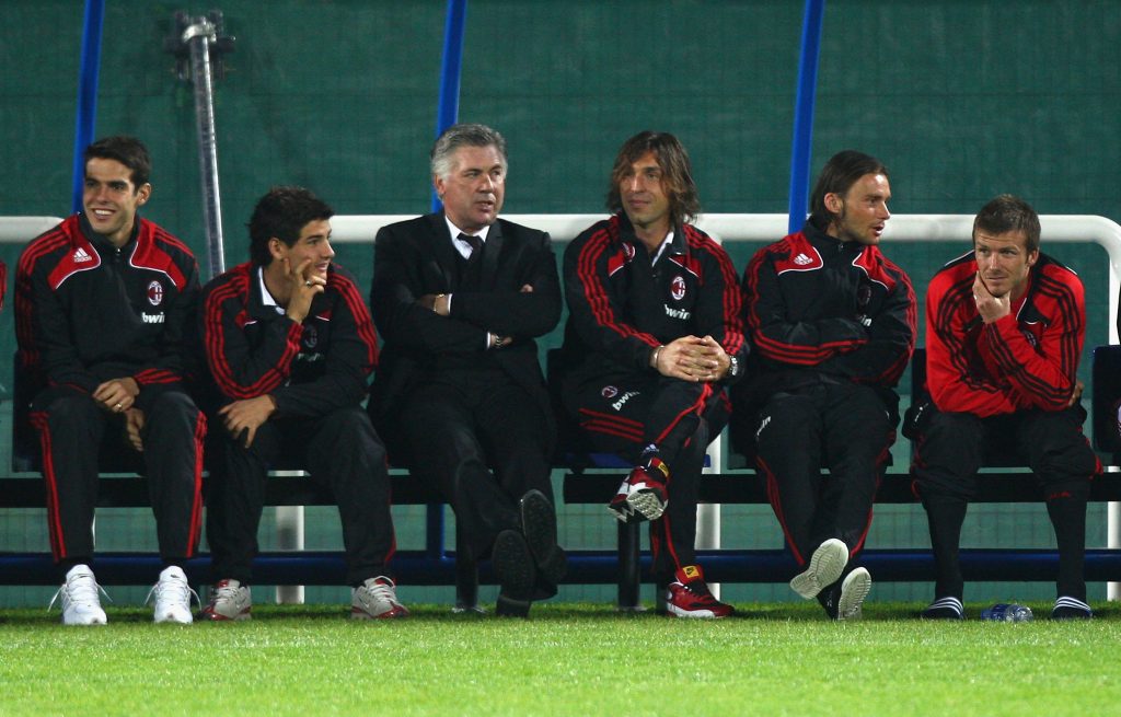 DUBAI, UNITED ARAB EMIRATES - JANUARY 06: (L to R) Kaka, Alexandre Pato, head coach Carlo Ancelotti, Andrea Pirlo, Marek Jankulowski and David Beckham of AC Milan watch the penalty shootout form the bench after the Dubai Football Challenge match between AC Milan and Hamburger SV at The Emirates Sevens Stadium on January 6, 2009 in Dubai, United Arab Emirates. (Photo by Ryan Pierse/Getty Images)