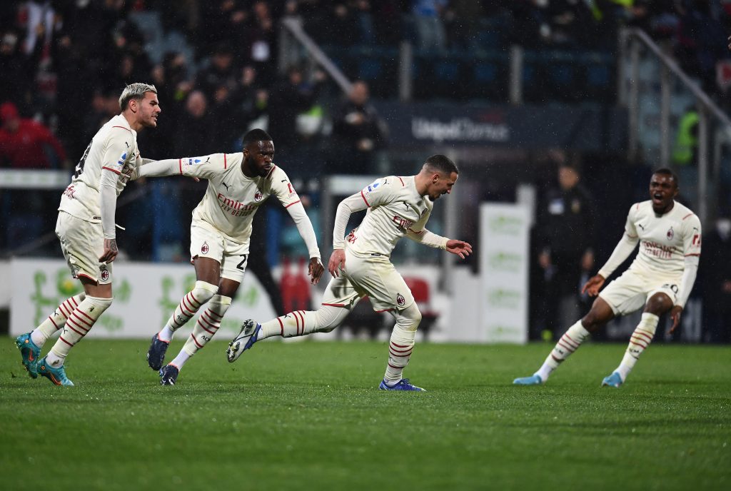 CAGLIARI, ITALY - MARCH 19: Ismael Bennacer of AC Milan celebrates with team-mates after scoring the opening goal during the Serie A match between Cagliari Calcio and AC Milan at Sardegna Arena on March 19, 2022 in Cagliari, Italy. (Photo by Claudio Villa/AC Milan via Getty Images)