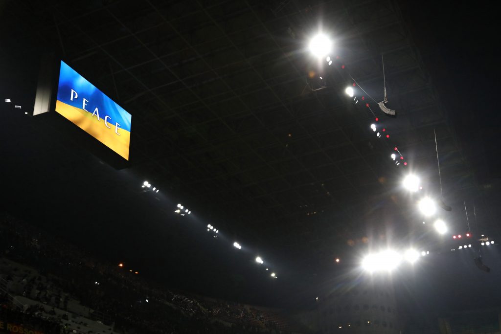 MILAN, ITALY - MARCH 01: The LED screen inside the stadium shows a Ukrainian flag to indicate peace and sympathy with Ukraine prior to the Coppa Italia Semi Final 1st Leg match between AC Milan and FC Internazionale at Stadio Giuseppe Meazza on March 01, 2022 in Milan, Italy. (Photo by Marco Luzzani/Getty Images)