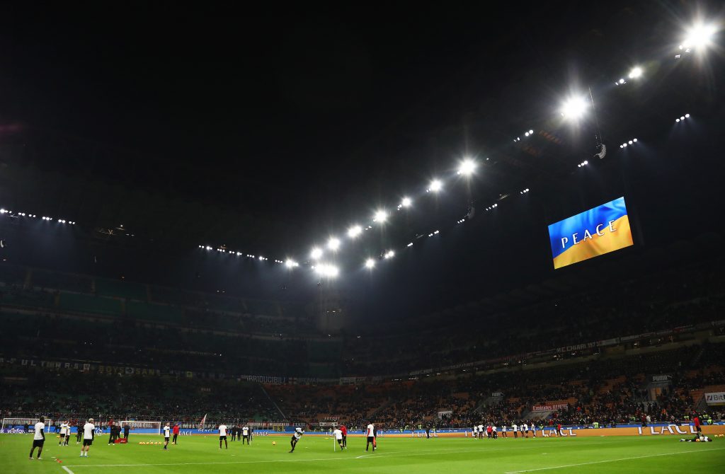 MILAN, ITALY - MARCH 01: The LED screen inside the stadium shows a Ukrainian flag to indicate peace and sympathy with Ukraine prior to the Coppa Italia Semi Final 1st Leg match between AC Milan and FC Internazionale at Stadio Giuseppe Meazza on March 01, 2022 in Milan, Italy. (Photo by Marco Luzzani/Getty Images)