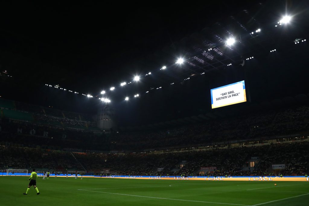 MILAN, ITALY - MARCH 01: The LED screen inside the stadium shows a Ukrainian flag to indicate peace and sympathy with Ukraine prior to the Coppa Italia Semi Final 1st Leg match between AC Milan and FC Internazionale at Stadio Giuseppe Meazza on March 01, 2022 in Milan, Italy. (Photo by Marco Luzzani/Getty Images)