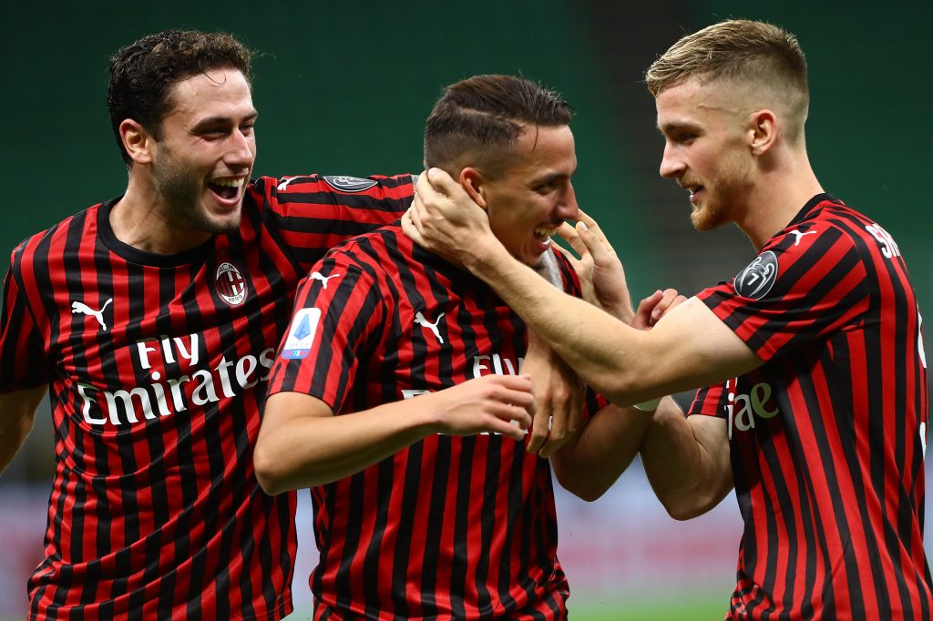 MILAN, ITALY - JULY 18: Ismael Bennacer (C) of AC Milan celebrates his goal with his team-mates Alexis Saelemaekers (R) and Davide Calabria (L) during the Serie A match between AC Milan and Bologna FC at Stadio Giuseppe Meazza on July 18, 2020 in Milan, Italy. (Photo by Marco Luzzani/Getty Images)