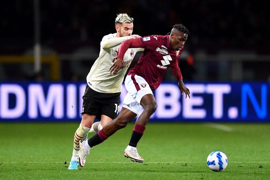 TURIN, ITALY - APRIL 10: Wilfried Singo of Torino FC battles for possession with Theo Hernandez of AC Milan during the Serie A match between Torino FC and AC Milan at Stadio Olimpico di Torino on April 10, 2022 in Turin, Italy. (Photo by Valerio Pennicino/Getty Images)