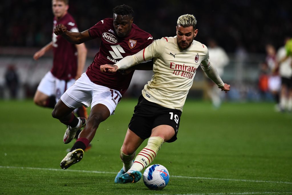 TURIN, ITALY - APRIL 10: Theo Hernandez of AC Milan competes for the ball with Wilfred Singo of Torino FC during the Serie A match between Torino FC v AC Milan on April 10, 2022 in Turin, Italy. (Photo by Claudio Villa/AC Milan via Getty Images)