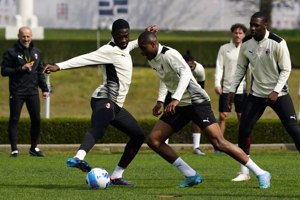 CAIRATE, ITALY - MARCH 31: (L-R) Fikayo Tomori and Pierre Kalulu in action during an AC Milan training session at Milanello on March 31, 2022 in Cairate, Italy. (Photo by Pier Marco Tacca/AC Milan via Getty Images)