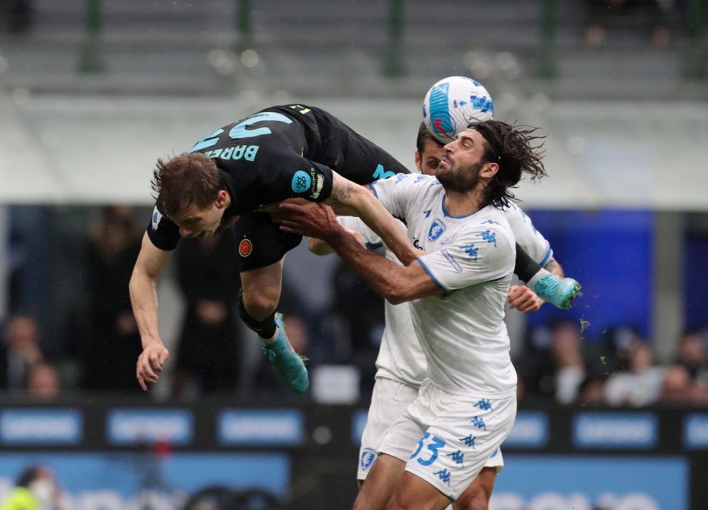 MILAN, ITALY - MAY 06: Nicolo Barella of FC Internazionale clashes with Sebastiano Luperto of Empoli FC during the Serie A match between FC Internazionale and Empoli FC at Stadio Giuseppe Meazza on May 06, 2022 in Milan, Italy. (Photo by Emilio Andreoli - Inter/Inter via Getty Images)