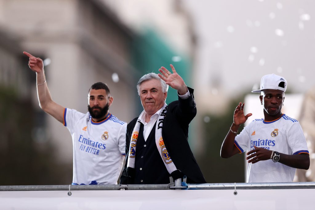 MADRID, SPAIN - APRIL 30: (L-R) Karim Benzema, Carlo Ancelotti, Head Coach of Real Madrid and Vinicius Junior celebrate at Plaza de Cibeles following their victory in their LaLiga match against RCD Espanyol which lead to their 35th LaLiga Championship title on April 30, 2022 in Madrid, Spain. (Photo by Gonzalo Arroyo Moreno/Getty Images)