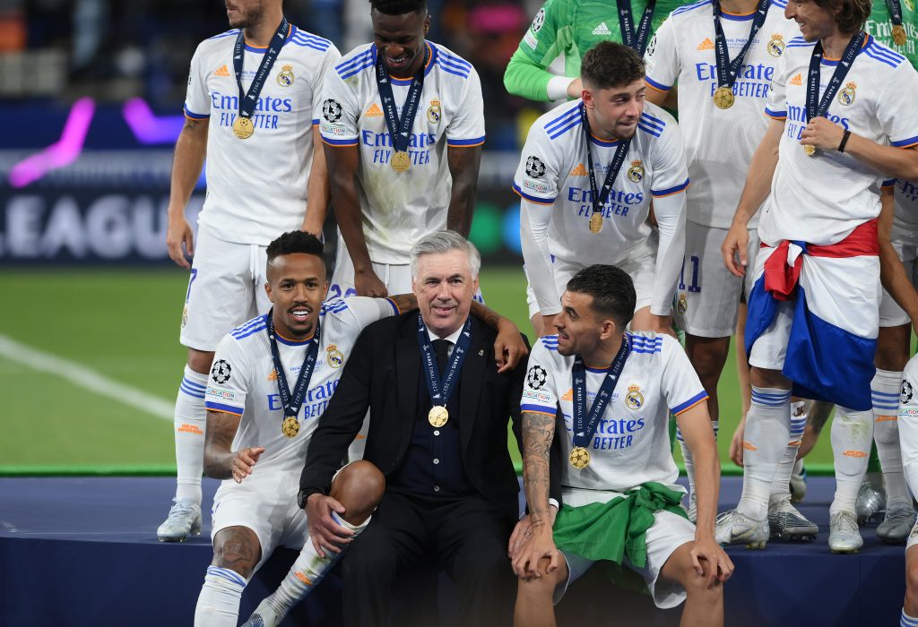 PARIS, FRANCE - MAY 28: Carlo Ancelotti, Head Coach of Real Madrid interacts with Eder Militao and Dani Ceballos of Real Madrid following their sides victory in the UEFA Champions League final match between Liverpool FC and Real Madrid at Stade de France on May 28, 2022 in Paris, France. (Photo by Shaun Botterill/Getty Images)