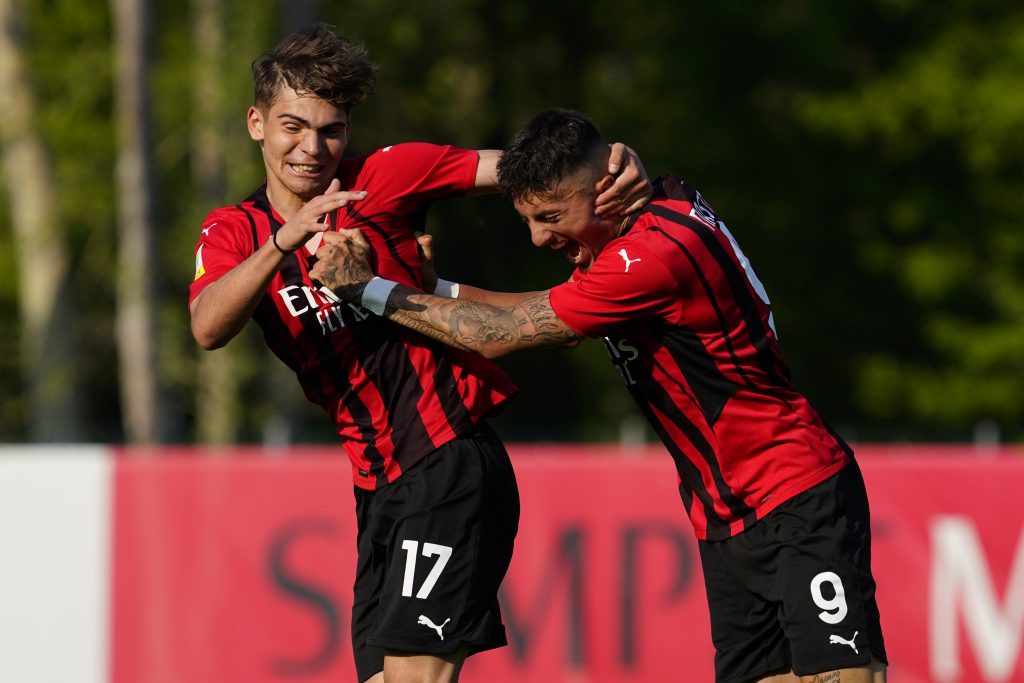 MILAN, ITALY - APRIL 16: (R) Marco Nasti of AC Milan U19 celebrates his first goal with his teammate Christian Foglio during the match between AC Milan U19 and Sampdoria U19 at Campo Sportivo Vismara on April 16, 2022 in Milan, Italy. (Photo by Pier Marco Tacca/AC Milan via Getty Images)