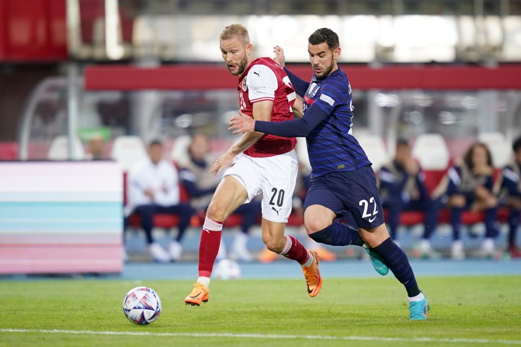 VIENNA, AUSTRIA - JUNE 10: Konrad Laimer of Austria battles for possession with Theo Hernandez of France during the UEFA Nations League - League A Group 1 match between Austria and France at Ernst Happel Stadion on June 10, 2022 in Vienna, Austria. (Photo by Christian Hofer/Getty Images)