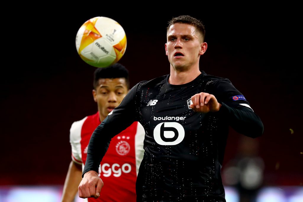 AMSTERDAM, NETHERLANDS - FEBRUARY 25: Sven Botman of Lille battles for the ball with David Neres of Ajax during the UEFA Europa League Round of 32 match between AFC Ajax and Lille OSC at Johan Cruyff Arena on February 25, 2021 in Amsterdam, Netherlands. Sporting stadiums around Netherlands remain under strict restrictions due to the Coronavirus Pandemic as Government social distancing laws prohibit fans inside venues resulting in games being played behind closed doors. (Photo by Dean Mouhtaropoulos/Getty Images)