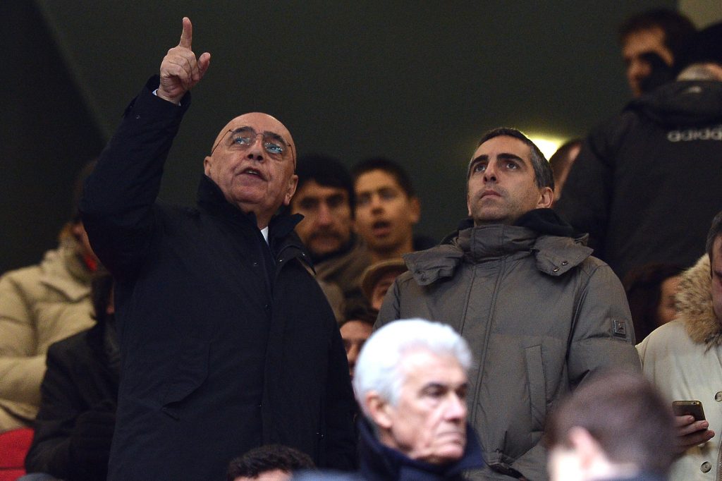 MILAN, ITALY - JANUARY 20: Vice President and CEO of Milan Adriano Gaglliani (L) gestures to his son Gianluca Galliani (R) looks on before the Serie A match between AC Milan and Bologna FC at San Siro Stadium on January 20, 2013 in Milan, Italy. (Photo by Tullio M. Puglia/Getty Images)