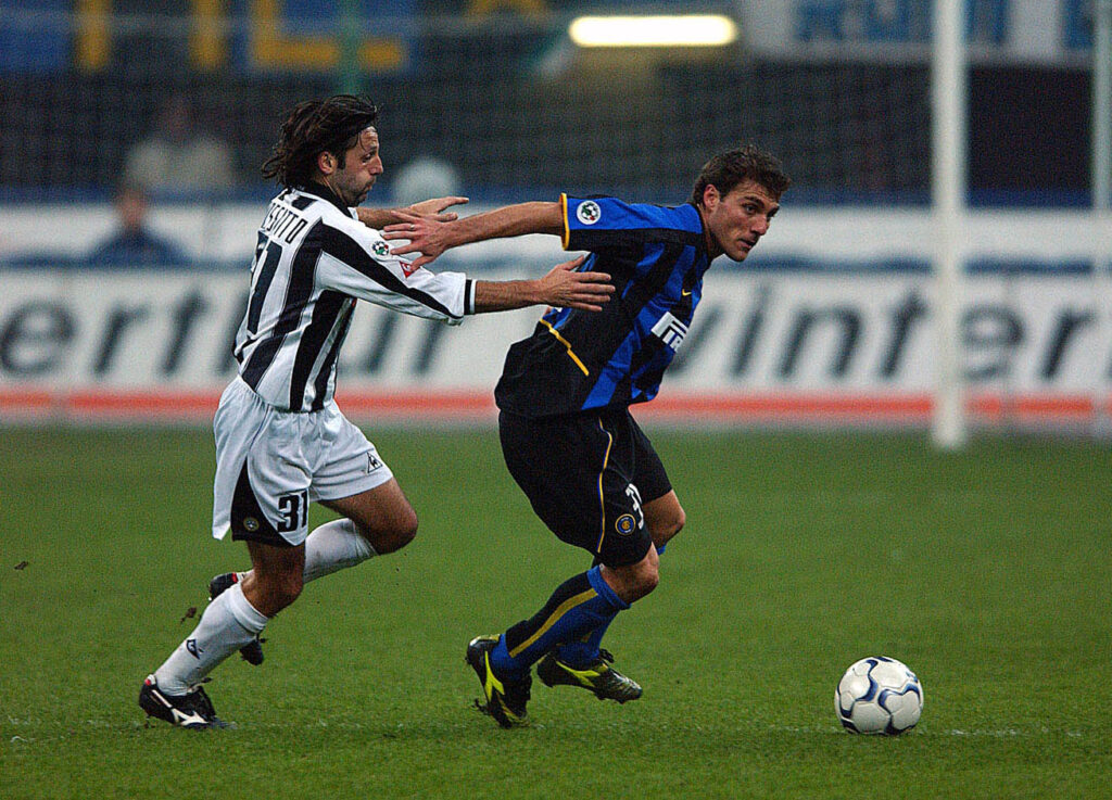 Christian Vieri of Inter Milan and Fabio Rossitto of Udinese in action