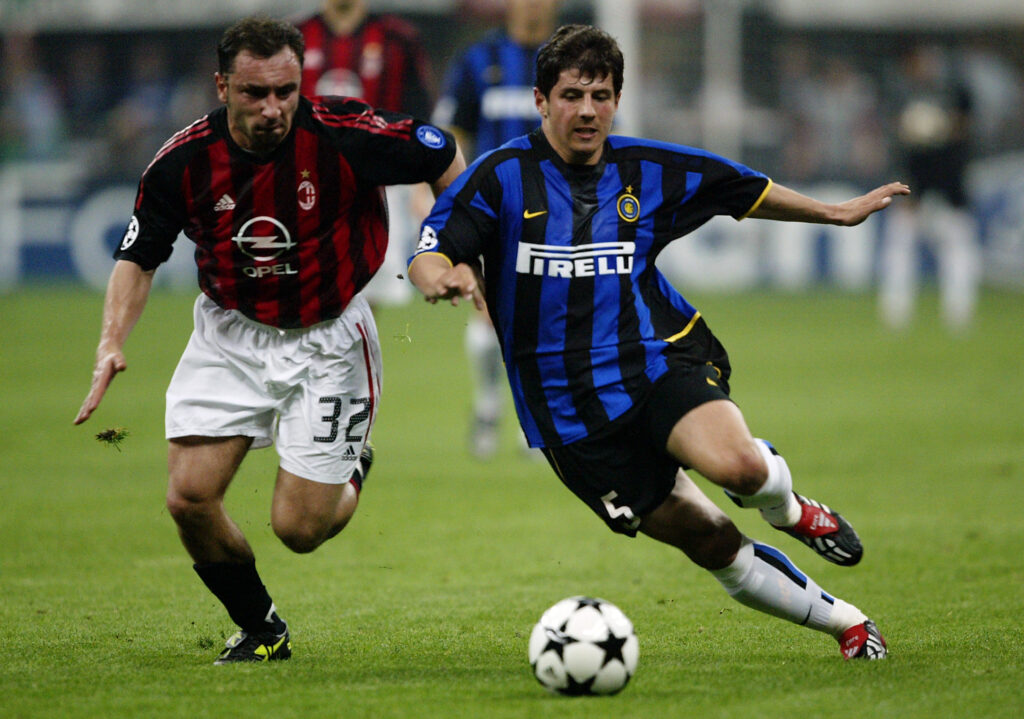Emre Belozoglu of Inter Milan and Cristian Brocchi of AC Milan