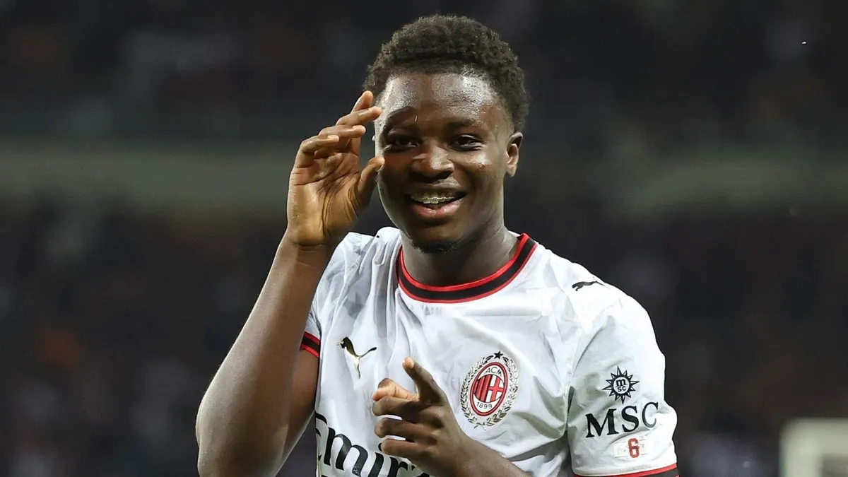 Alphadjo Cisse celebrating in the AC Milan away shirt during the 2026-27 season